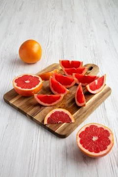 Organic Red Ruby Grapefruit on a Wooden Board, side view. Stock Photos