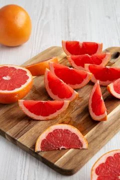 Organic Red Ruby Grapefruit on a Wooden Board, low angle view. Stock Photos