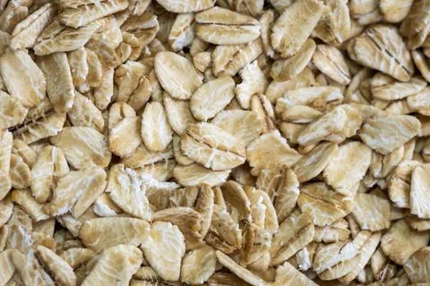 Organic Rolled Oats Macro Background with Natural Texture Stock Photos