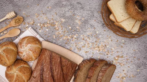 Organic rye bread, bagels, buns and toast bread appear - Stop motion Stock Footage 131395598