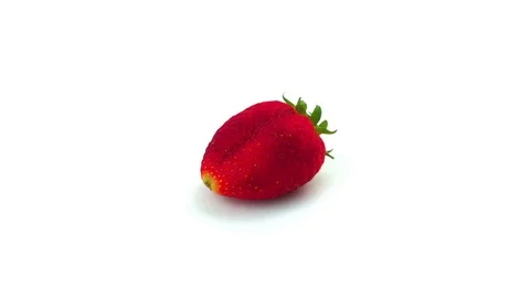 Organic Strawberry on white background rotating 360 degrees, loopable Stock Footage 69712006