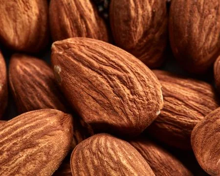 Organic texture of almonds. View from above. Almonds macro background. Almo.. Stock Photos