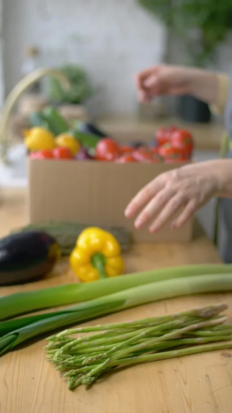 Organic vegetables vertical video. preparing healthy meal. box full of fresh Stock Footage 273510130