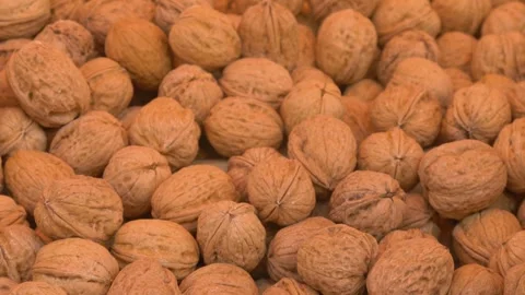Organic walnuts in shells market display Stock Footage 334656353