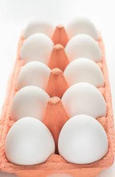 Organic white eggs in egg box. Close up. Stock Photos