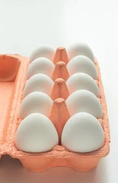 Organic white eggs in egg box. Close up. Stock Photos