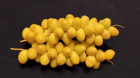 Organic Yellow Dates Bunch Displayed On Black Background Ready To Eat Stock Footage 340956301