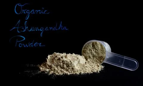 Organica Ashwagandha powder isolated on black background Stock Photos