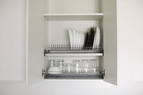 Organization for small spaces. Kitchen organization. Stock Photos