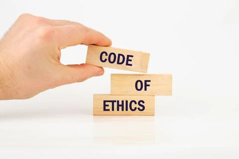 Organizational concept. CODE OF ETHICS is written on wooden blocks it is laid Stock-Fotos