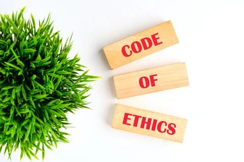 Organizational concept. CODE OF ETHICS is written on wooden blocks on wooden  스톡 사진