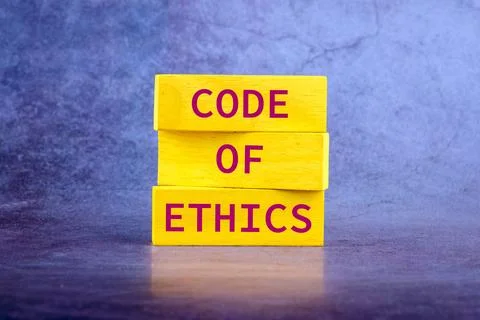 Organizational concept. CODE OF ETHICS is written on wooden blocks on top of  Stock Photos