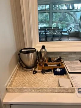 An organized bar setup in the kitchen of a luxury vacation rental home on K.. Stock Photos