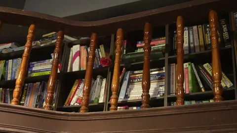 Organized Display of Numerous Belongings in Empty Bookshelf Stock Footage 248605989