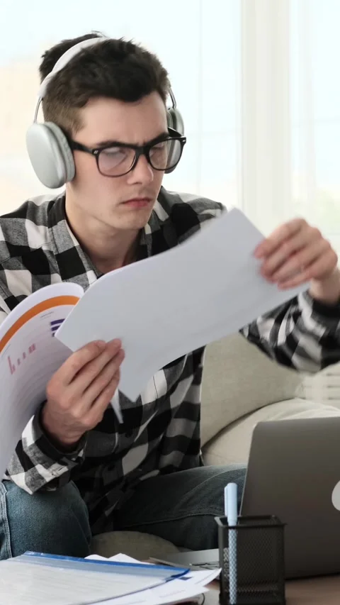 Organized Freelancer Doing Paperwork And Using Laptop From Home Office Video stock 287326654