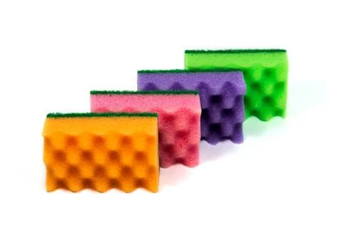 An organized stack of cleaning sponges, isolated on the white background Stock Photos