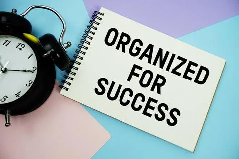 Organized For Success text written on notepad with alarm clock flat lay on .. Stock Photos