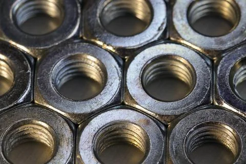 Organized Threaded Metal Hex Nuts On Flat Surface Stock-Fotos