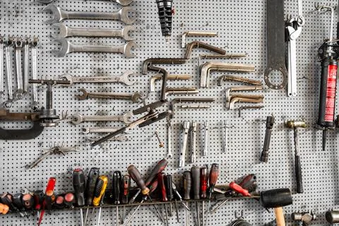 Organized workshop tool wall with hand tools Photos