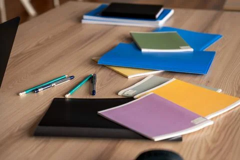 An Organized Workspace Featuring Assorted Notebooks and Writing Instruments.. Stockfoto's