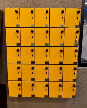 Organized yellow mailboxes Stock Photos