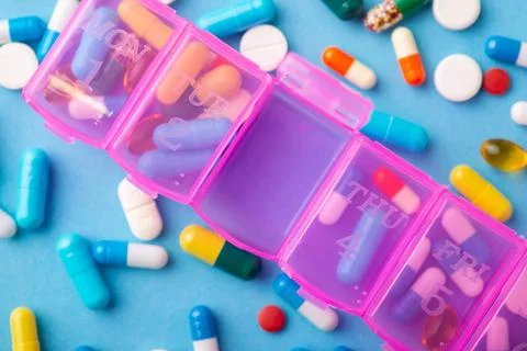 Organizer box for taking pills, one door is open Stock Photos