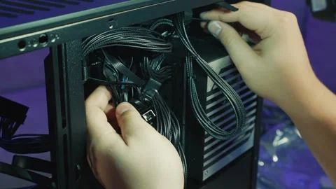 Organizing and routing power supply cables inside computer case Stock Footage 340883080