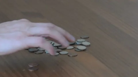 Organizing coins by hand Stock Footage 8156250