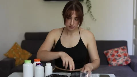 Organizing daily supplements 動画素材 339096278