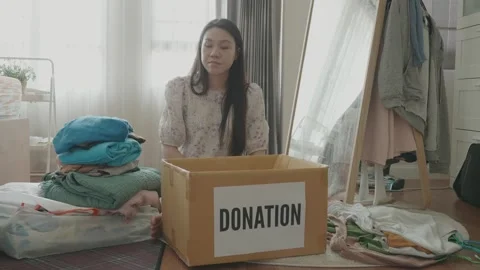 Organizing Donations for a Cause at Home Stock Footage 315975138