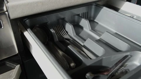 Organizing forks in kitchen drawer, simple everyday home lifestyle Stock Footage 320423669