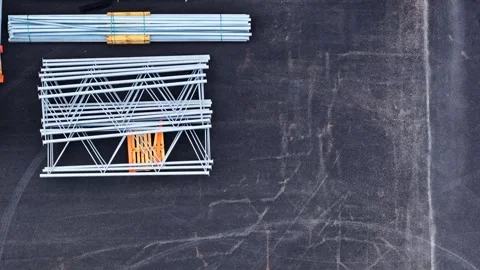 Organizing metal racking systems and wooden pallets for warehouse logistics Stock Footage 333549895