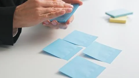 Organizing Notes with Blue Sticky Papers on Desk Stock Photos