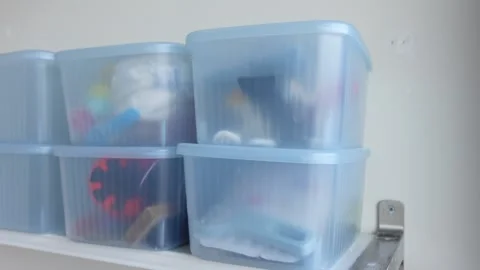 Organizing storage boxes for better home space Stock Footage 323049135