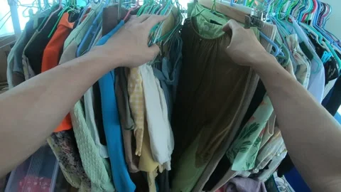 Organizing a Wardrobe: Sorting Clothes and Outfits Stock Footage 313918692