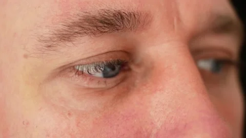 Organs of sight of human. Man moves his eyes with red vessels and watching Stock Footage 133740249