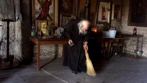 Orhei Monk Sweeping his monastery (Moldova). Stock Footage 84785907