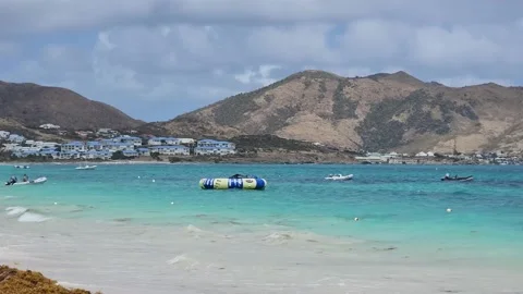 Orient Beach St. Marteen View with Floating Inflatable Stock Footage 237383236