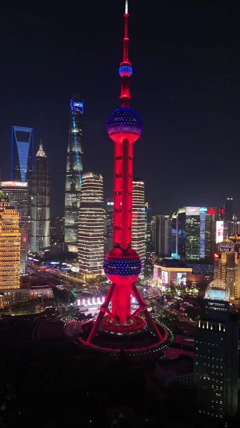 Oriental Pearl Tower Glowing Red at Night in Shanghai, China Stock Footage 335967793
