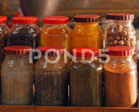 Oriental spices in cans Stock Photos