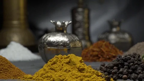 Oriental spices on a dark background move on a steep surface Stock-Footage 123561239