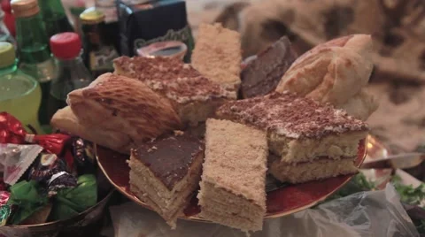 Oriental sweets are on the festive table in the dish Stock Footage 64731713