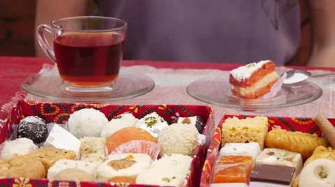 Oriental sweets in a box on the background female hands. Stock Footage 62227486