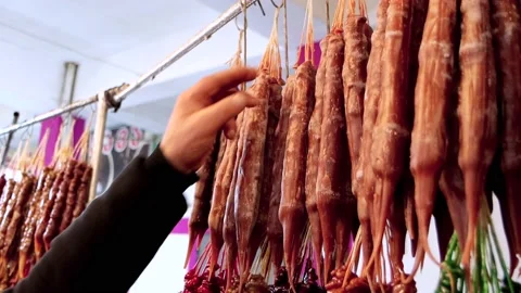 Oriental sweets, nuts in grape juice, choice and buy at Georgian bazaar, Stock Footage 199001785