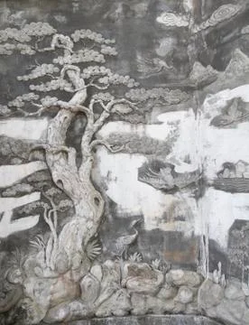 Oriental tree basrelief on wall Stock Photos