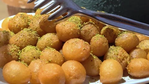 Oriental Turkish sweets on showcase in assortment. Stock Footage 314799568