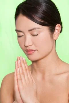 Oriental woman praying Stock Photos