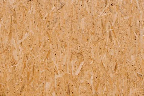 Oriented strand board. A close-up of a board made of pressed sawdust. 스톡 사진