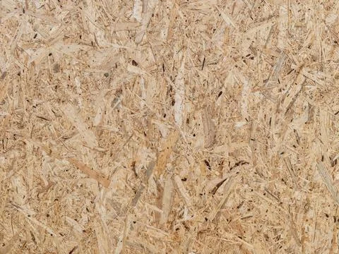 Oriented strand board surface texture with rough wood chips, beige brown to.. Stock Photos
