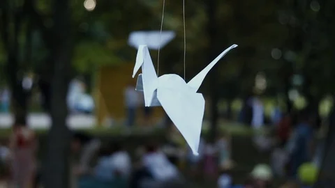 Origami paper cranes hanging on tree Stock Footage 79681865